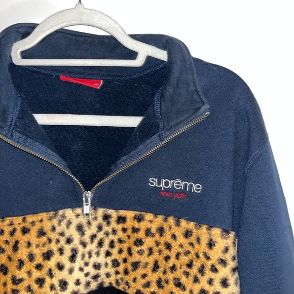 Supreme brand navy and leopard print half-zip fleece